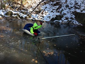 Surveyor breaking ice