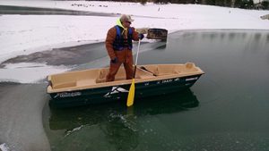 Surveyor in a boat